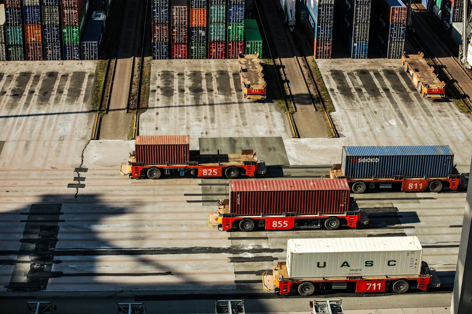Rows of freight containers on trailers at a logistics terminal
